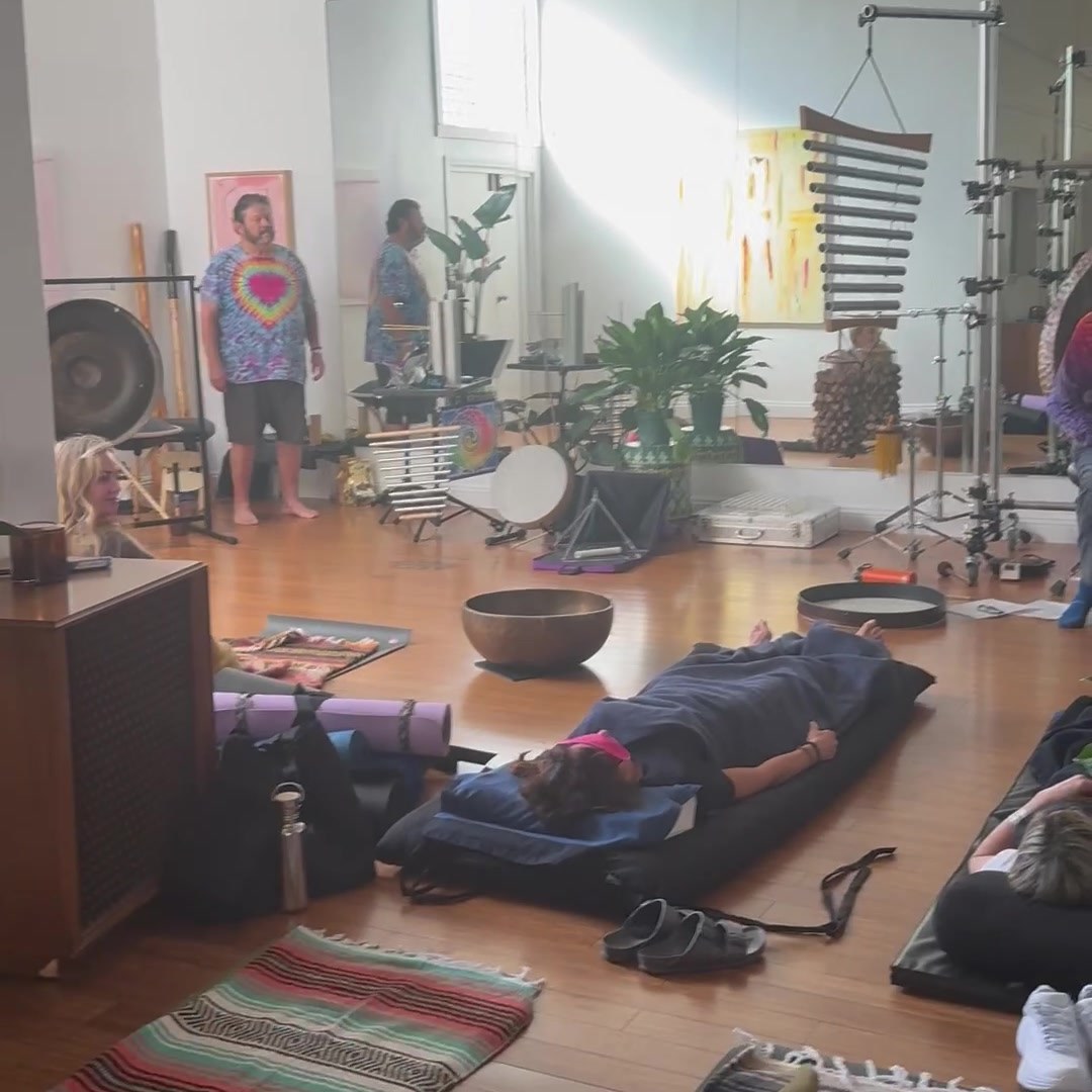 The room during a sound bath at IS/BE Outpost — mats, blankets and singing bowls