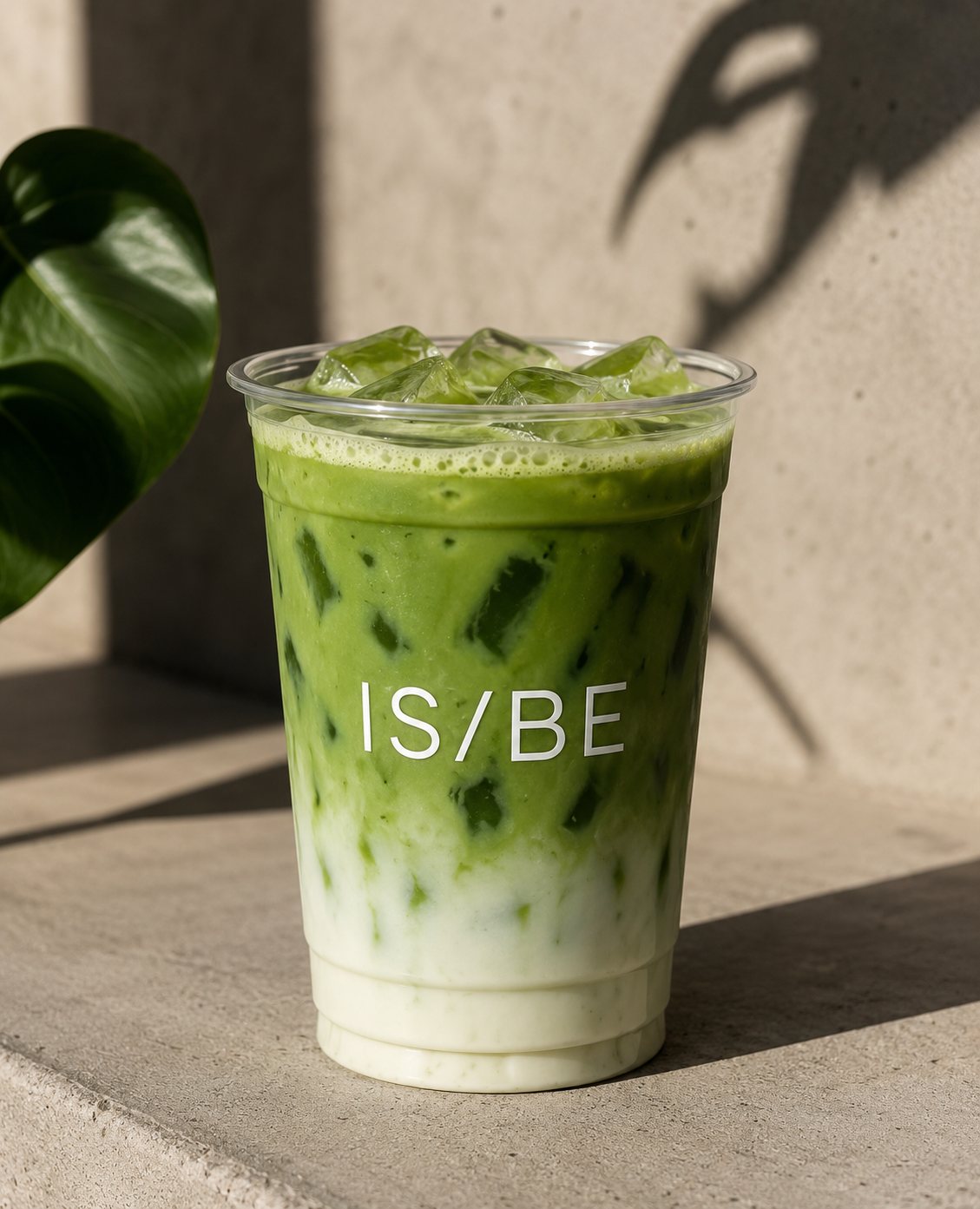 Iced matcha in a glass on the counter at IS/BE Outpost in Carlsbad Village — matcha bar coming soon